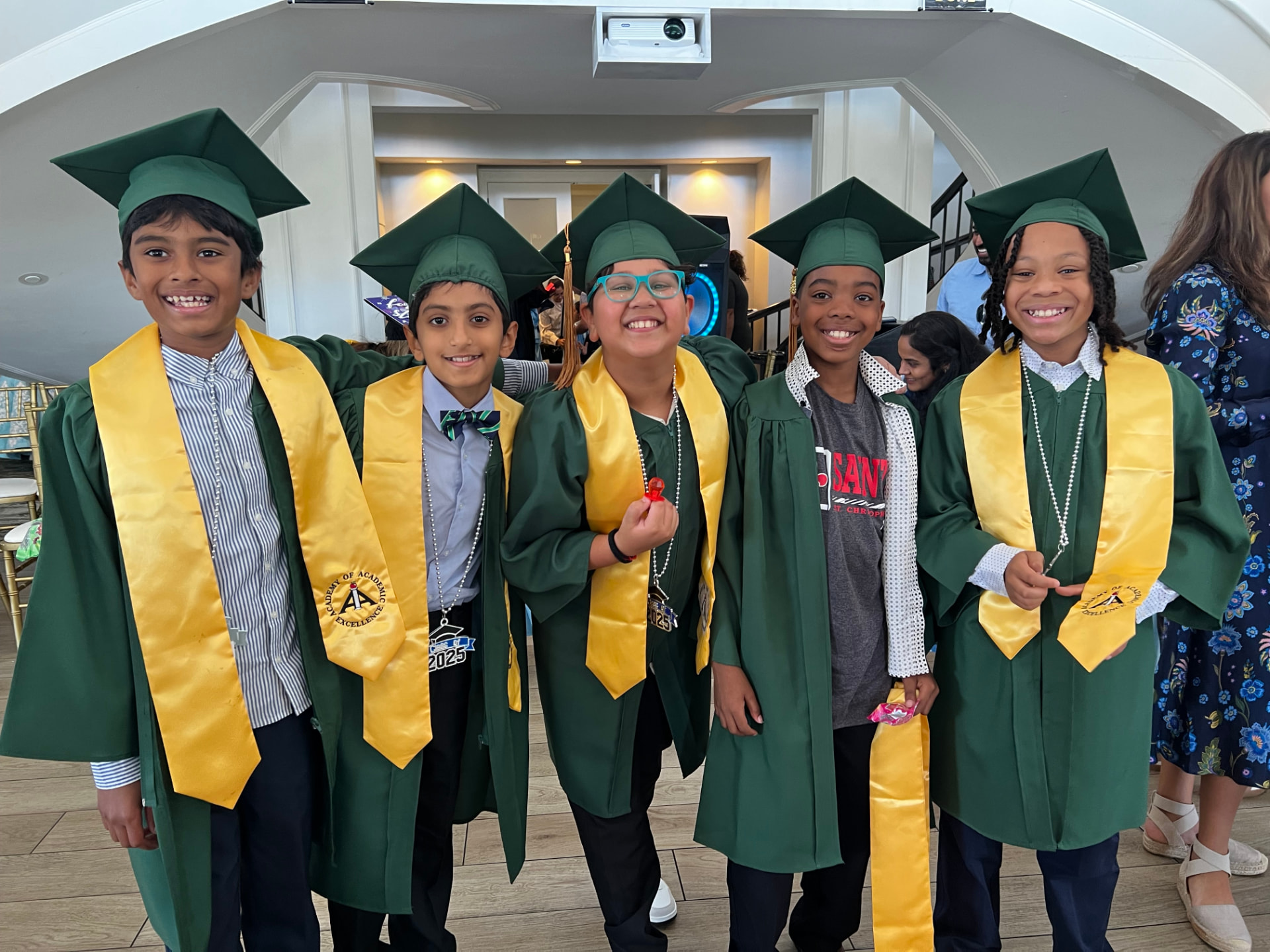 Fifth grade graduates in caps and gowns