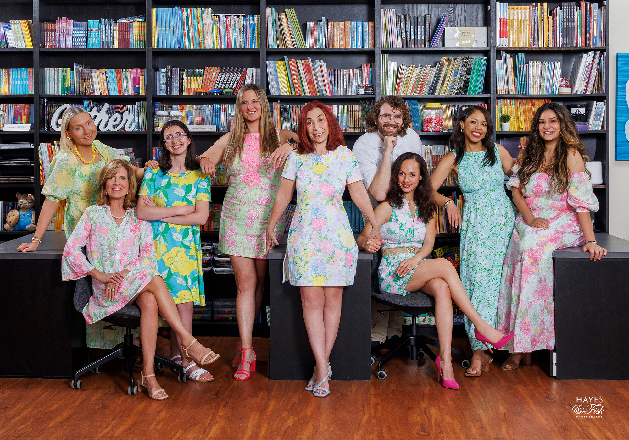 The faculty and staff of Academy of Academic Excellence gathered in the school library